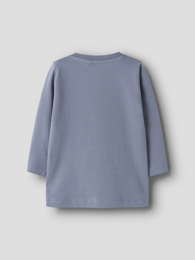 Blue long-sleeve shirt on a light gray background
