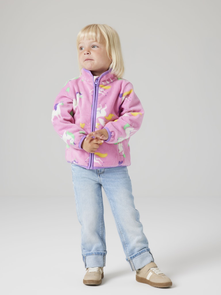 Child wearing a pink fleece jacket with colorful patterns on a plain background