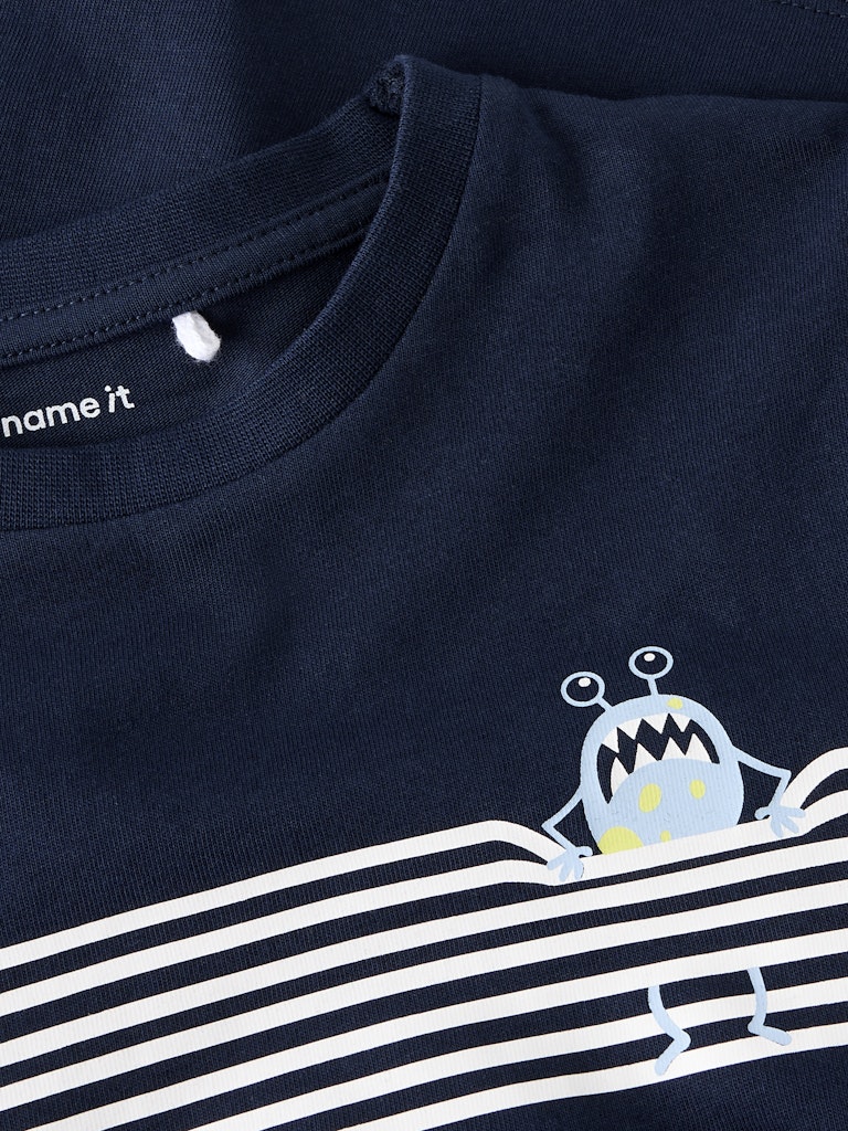 Navy blue t-shirt with a cartoon character and white stripes, brand 'name it' visible.
