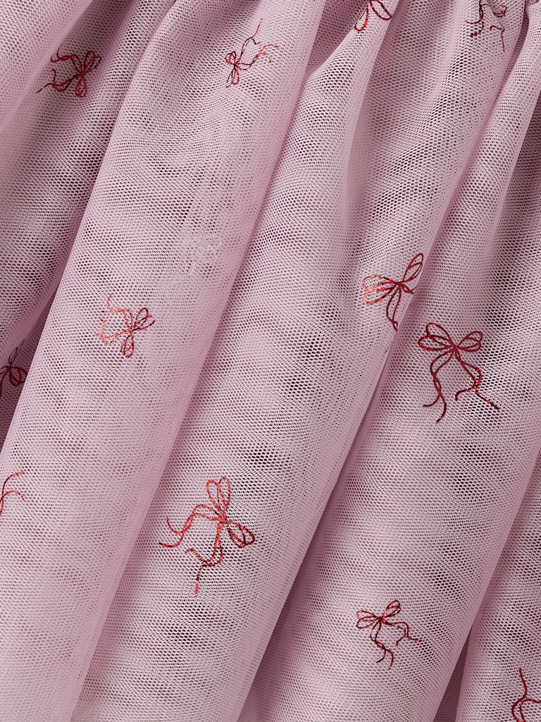 Pink fabric with embroidered red bows