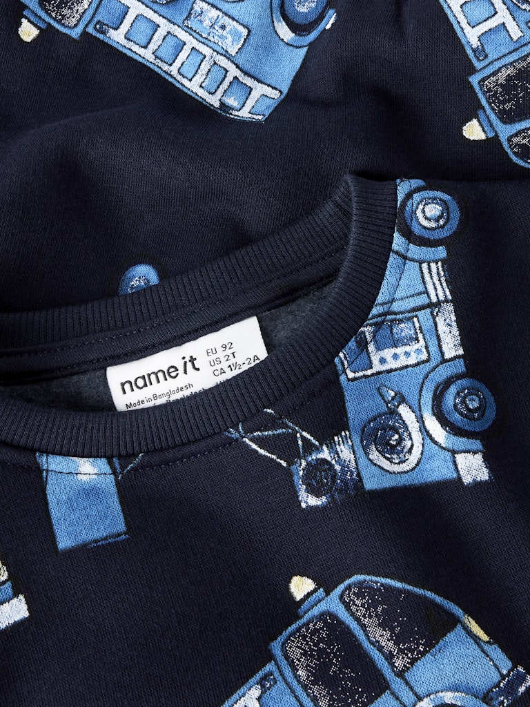 Navy blue sweatshirt with blue car pattern and 'name it' label.
