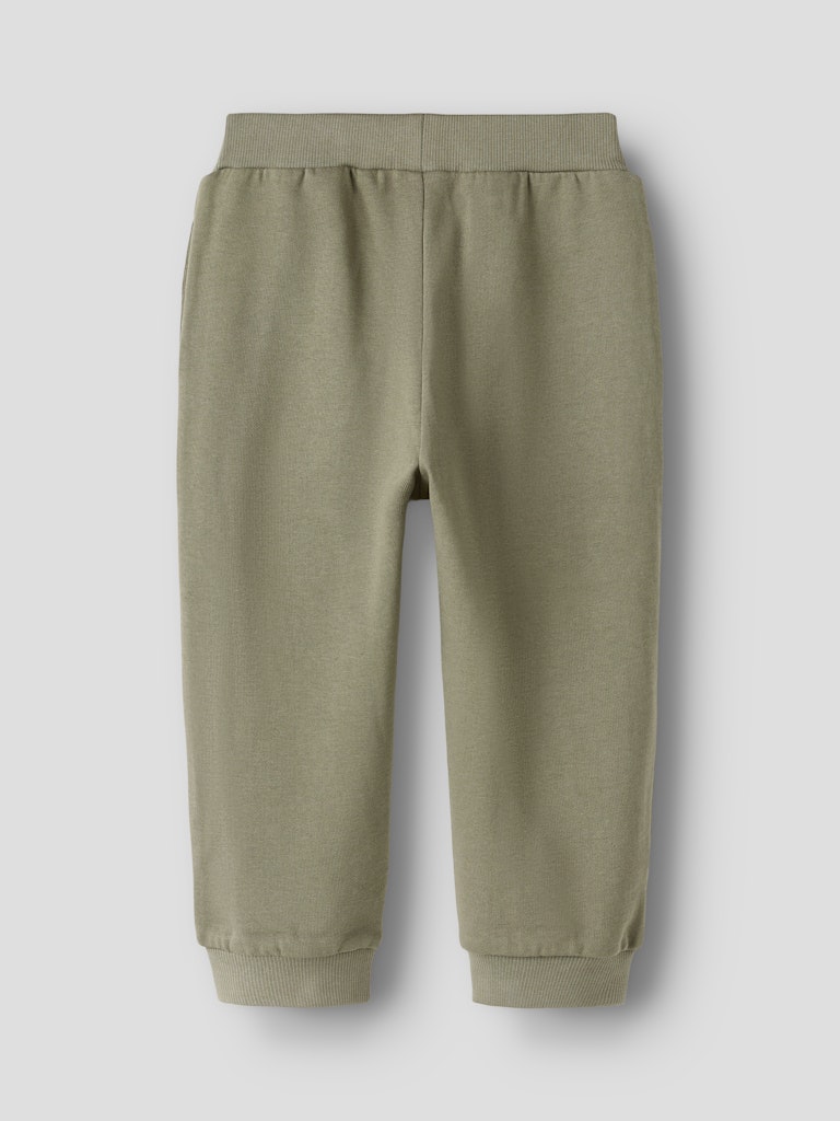 Green jogger pants on a light gray background