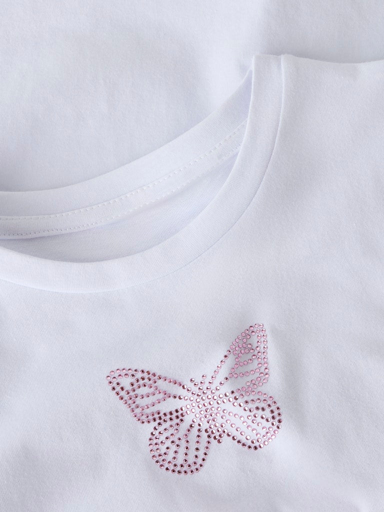 White t-shirt with a pink butterfly design on a white background