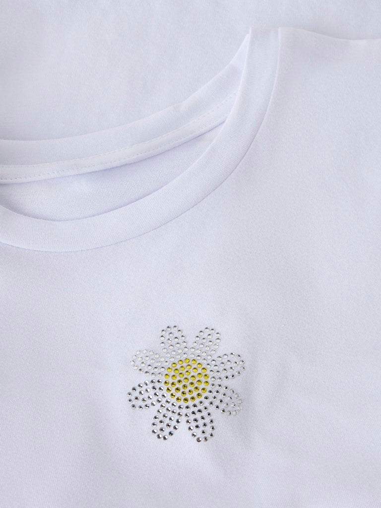 White shirt with a rhinestone flower design on a white background