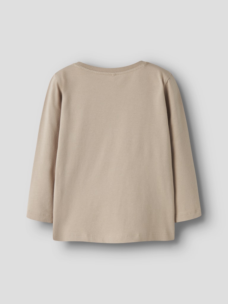 Beige long-sleeve top on a light gray background