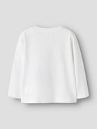 A white long-sleeve cropped top shown from the back, photographed flat against a light gray background.