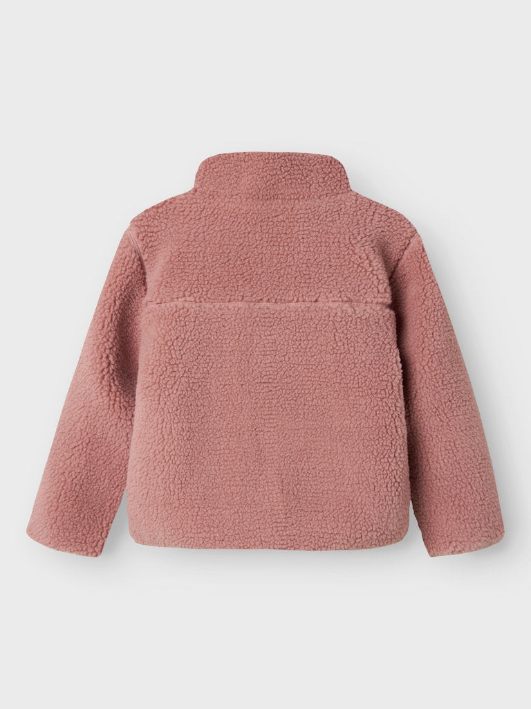 Pink fleece jacket on a light gray background