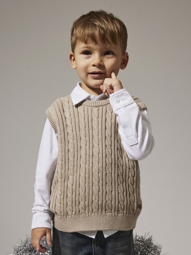 Boy wearing Roman Knit Vest-Island Fossil