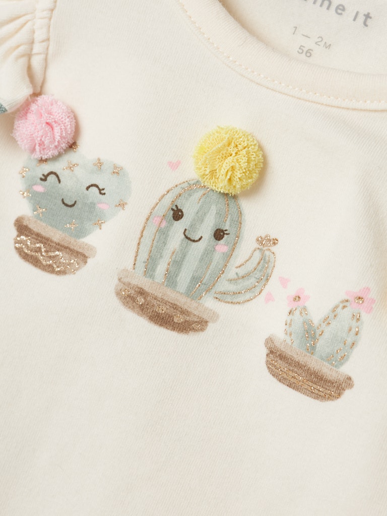 Jodie Cap Sleeve Cloud Dancer Top-Chest print detail