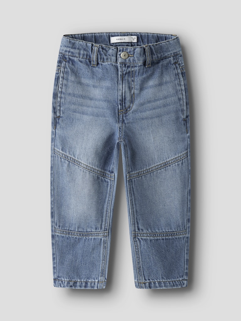 Blue denim jeans on a light gray background