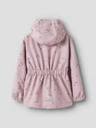 Pink children's raincoat with heart pattern on a light gray background