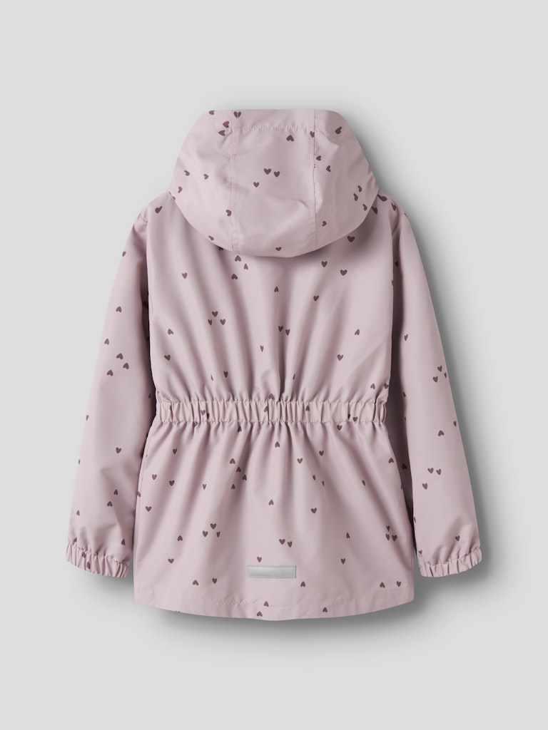 Pink children's raincoat with heart pattern on a light gray background