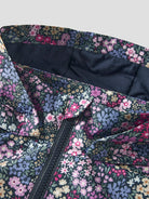 Floral patterned fabric with a zipper on a light gray background