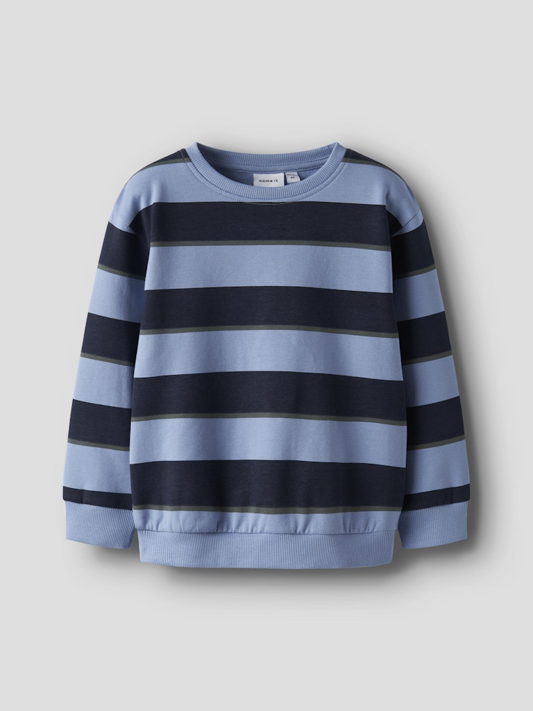 Blue and navy striped sweater on a light gray background