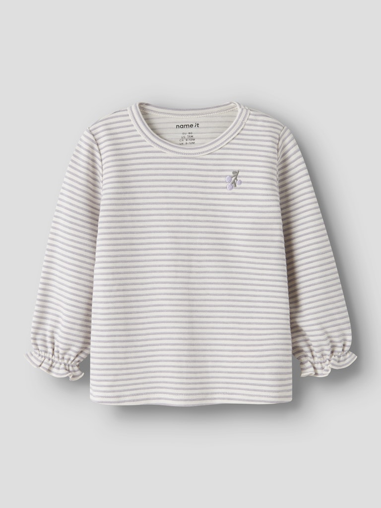 Striped long-sleeve shirt with a small logo on a light gray background