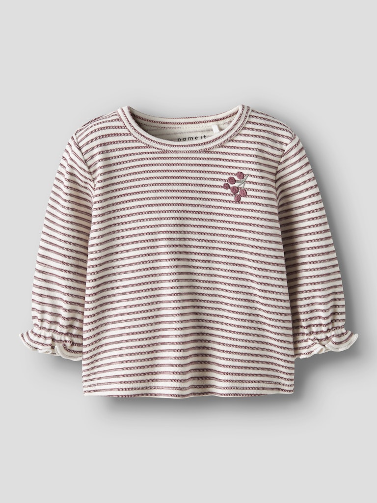 Striped baby shirt with a small design on a light gray background