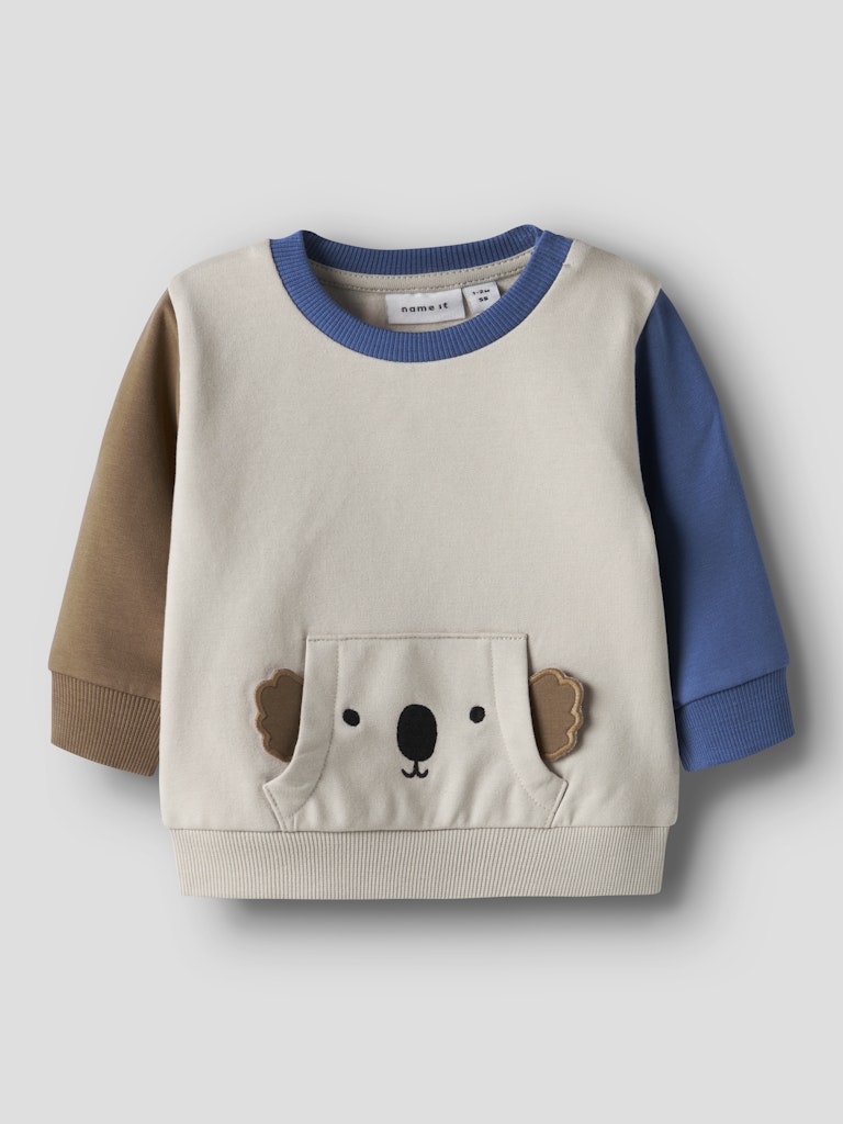Children's sweater with a koala design on a light gray background