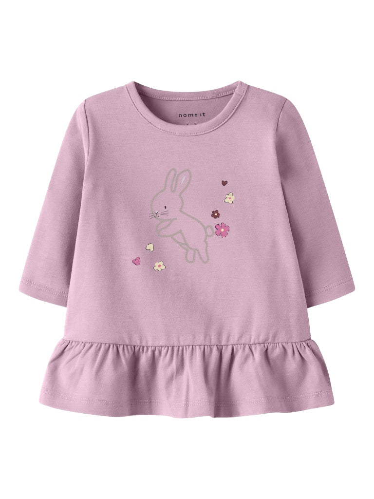 Purple children's dress with bunny design on a white background