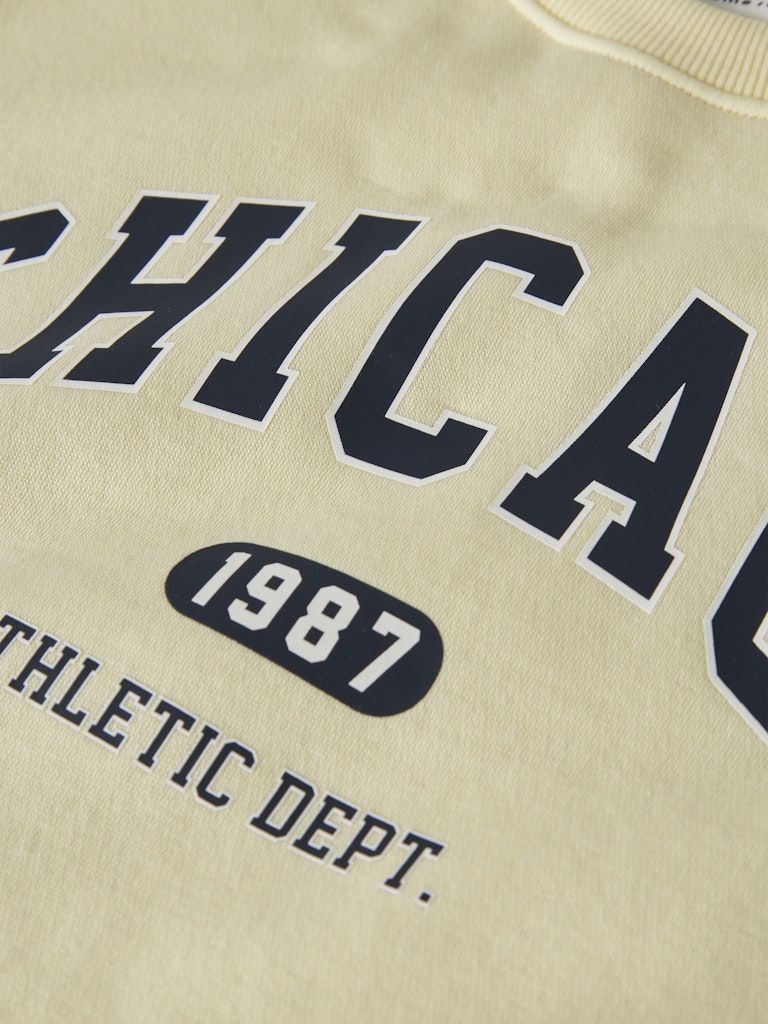 Beige sweatshirt with 'CHICAGO 1987 ATHLETIC DEPT.' text