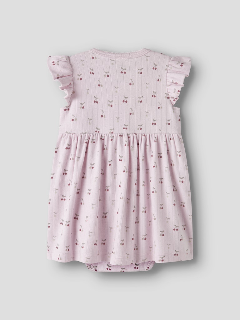 Pink baby dress with floral pattern on a light gray background