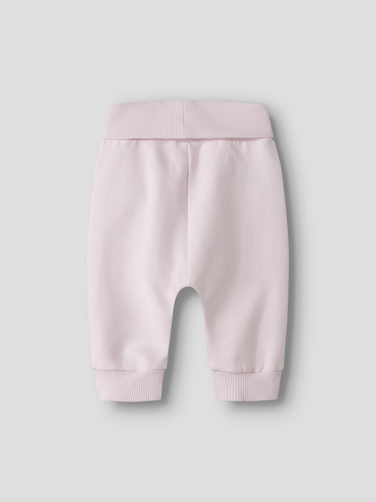 Pink baby pants on a light gray background