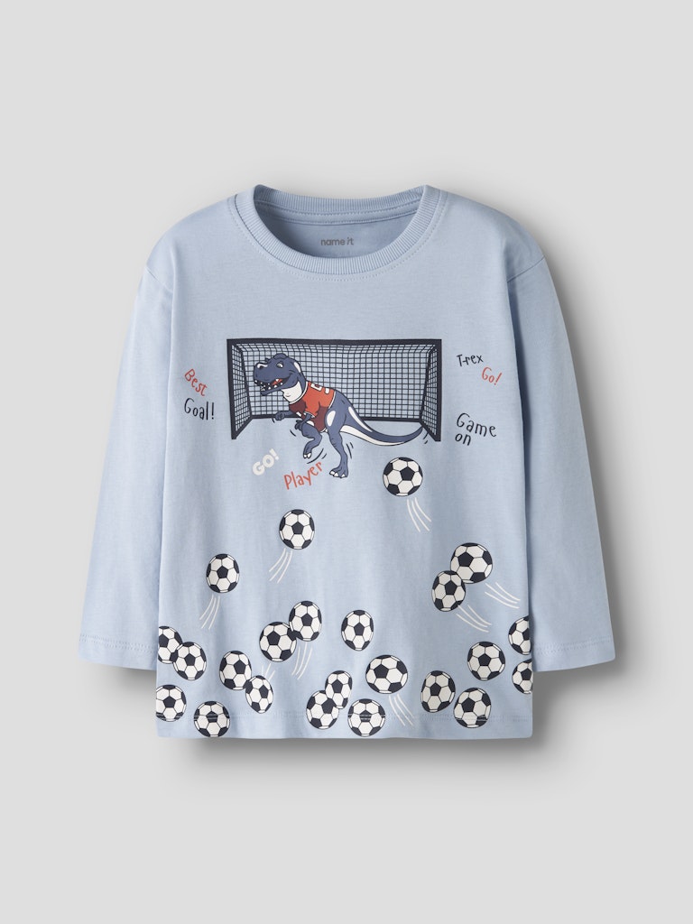 Light blue long sleeve top with dinosaur playing football graphic