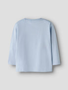 Light blue shirt on a gray background