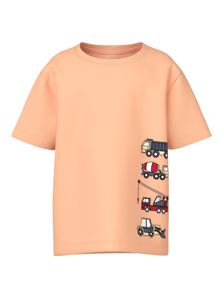Peach-colored t-shirt with cartoon truck designs on a white background