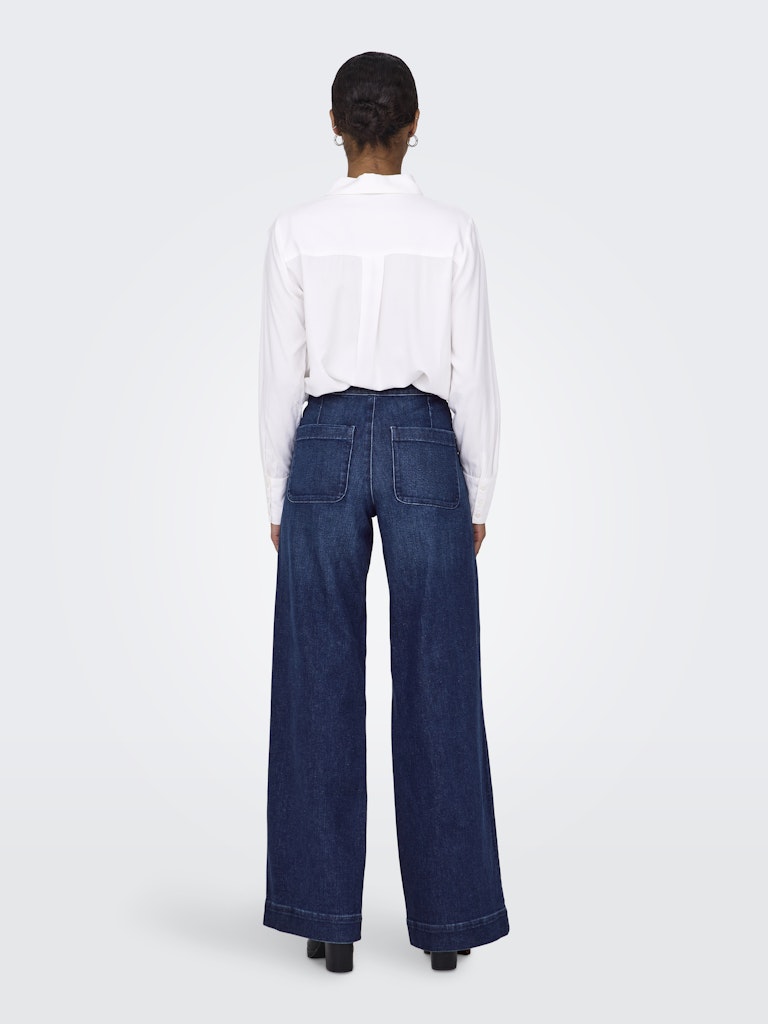 Model back view of high waisted button fly jeans