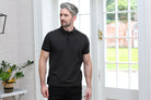 Kenrow Otto Polo in khaki worn by a model, angled view