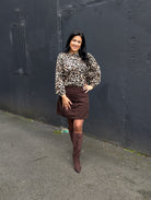 Tina in the Naomi Leopard Blouse paired with the Charlotte Mocha Cord Skirt