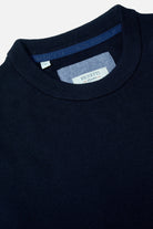 Benetti Quinn Navy O Neck Knit close-up of the ribbed crew neckline and inner labels