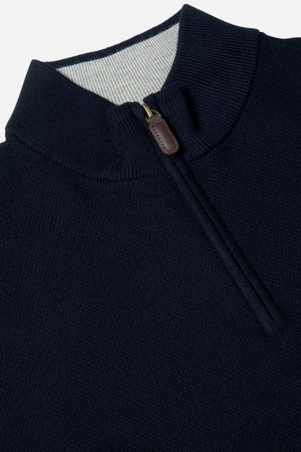 Benetti Quinn Navy 1/4 Zip close-up of the collar and quarter-zip fastening, with ribbed trim and leather pull tab visible.