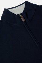 Benetti Quinn Navy 1/4 Zip close-up of the collar and quarter-zip fastening, with ribbed trim and leather pull tab visible.