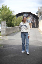 Superdry Ladies Athletic Essentials Off White Relaxed Hoodie Desert Bone Off White model front view
