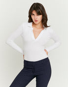 Model front view of women's white V neck bodysuit