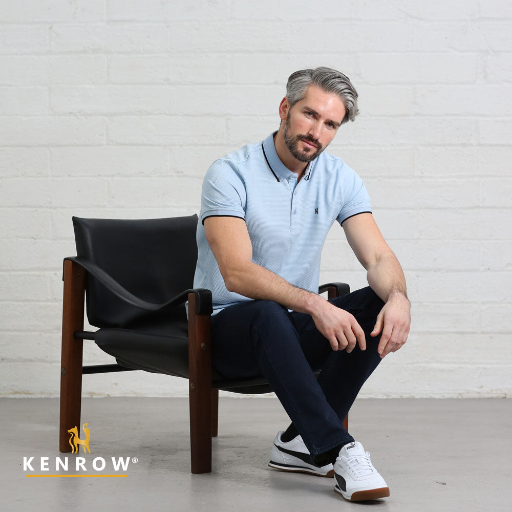 Kenrow Shay sky polo shirt worn by model while seated