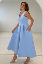 Girl In Mind Bethany blue V-neck skater midi dress, angled front model view with pockets