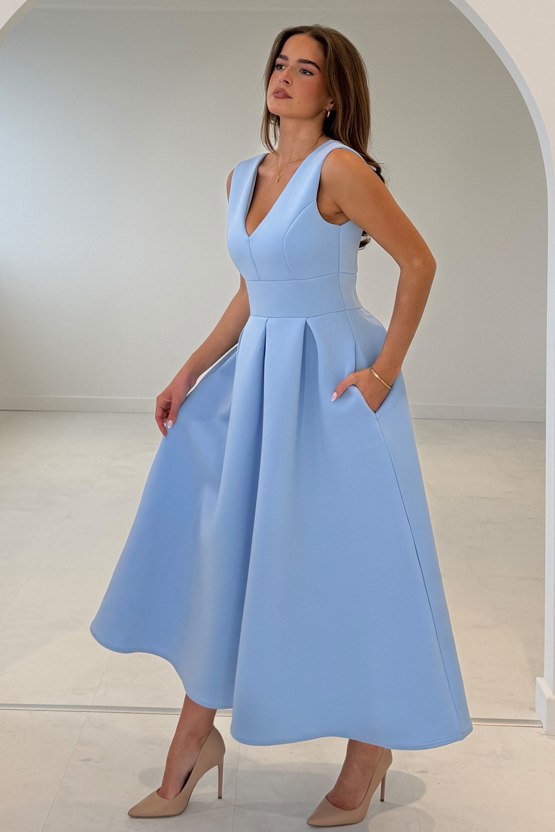 Girl In Mind Bethany blue V-neck skater midi dress, angled front model view with pockets