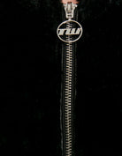 Zip fastening detail on black fur jacket