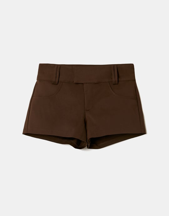 Close-up of brown mini shorts detail