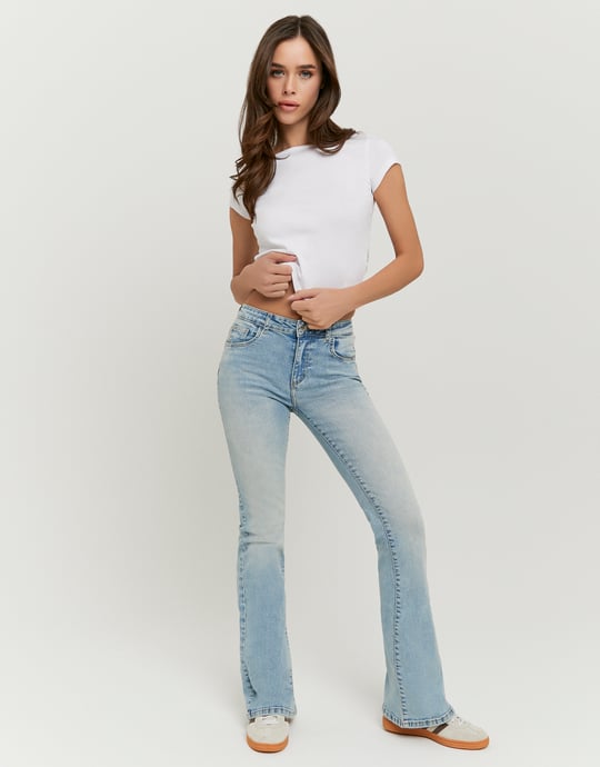 Tally Weijl blue mid waist flare jeans worn by model, front view