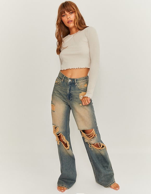 Model front view of distressed wide leg jeans