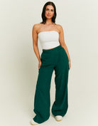 Model front view of women's green linen pants