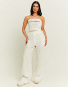 Front model view of the white wide leg linen pants