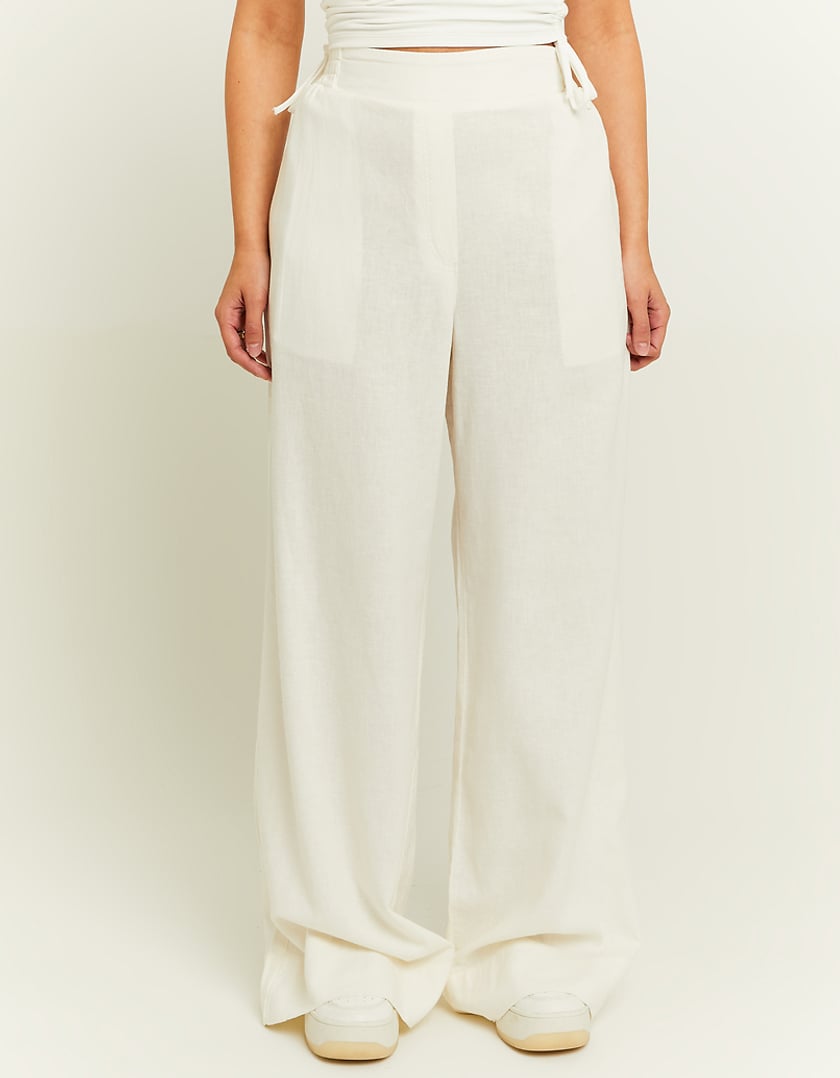 Back model view of the white wide leg linen pants