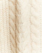 Close-up detail of white cropped jumper