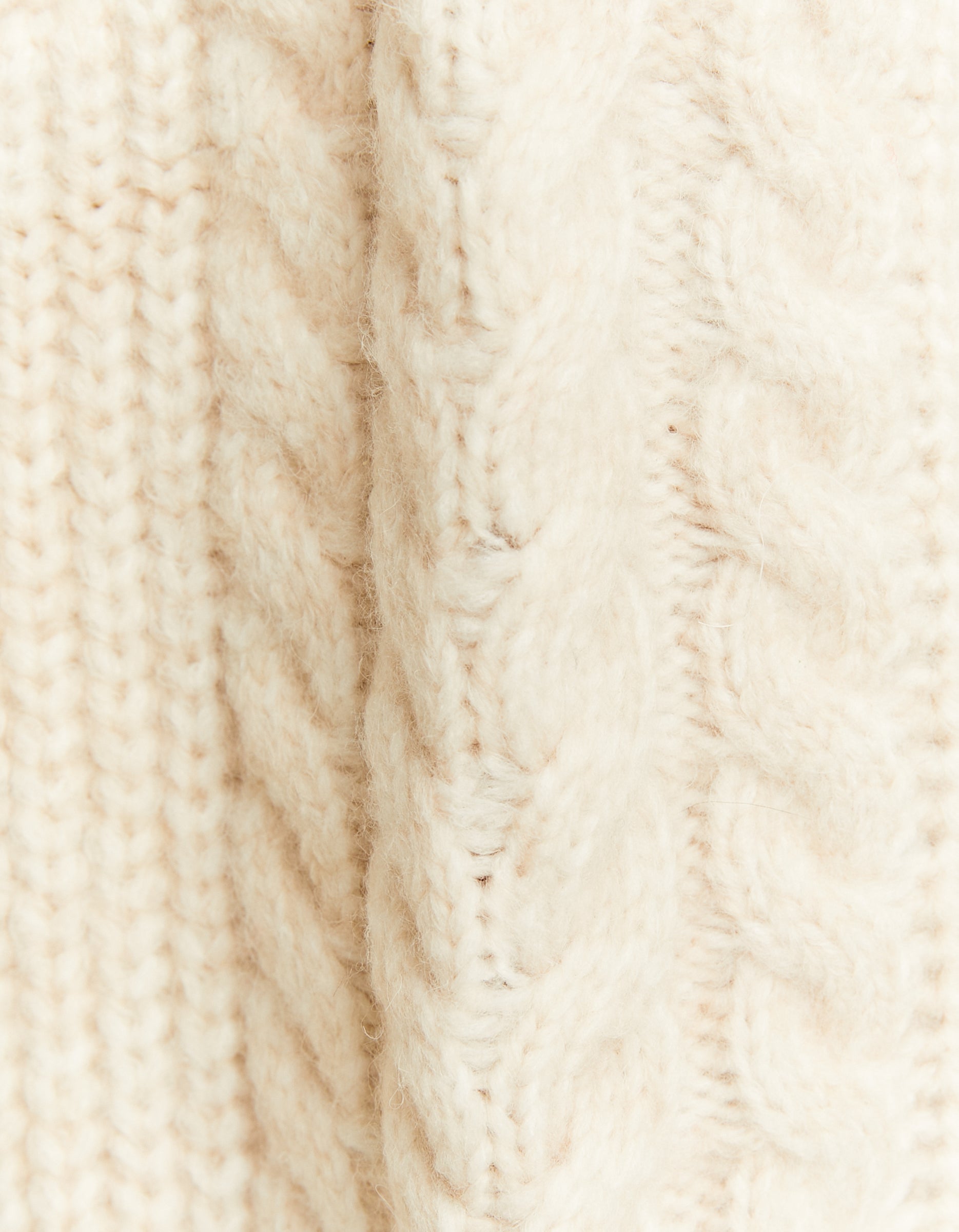 Close-up detail of white cropped jumper