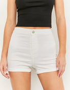 Front detail view of women's white high waisted denim shorts