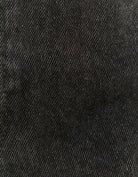 Close-up of black mom denim shorts detail